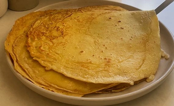 A stack of crepes on a plate
