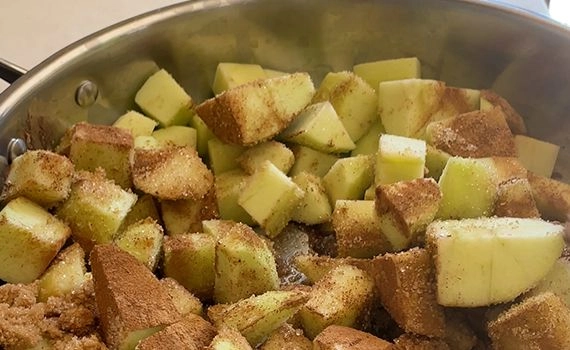 Diced apples, spices and sugars in a pan