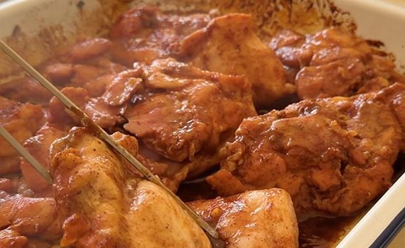Turning chicken in a tray
