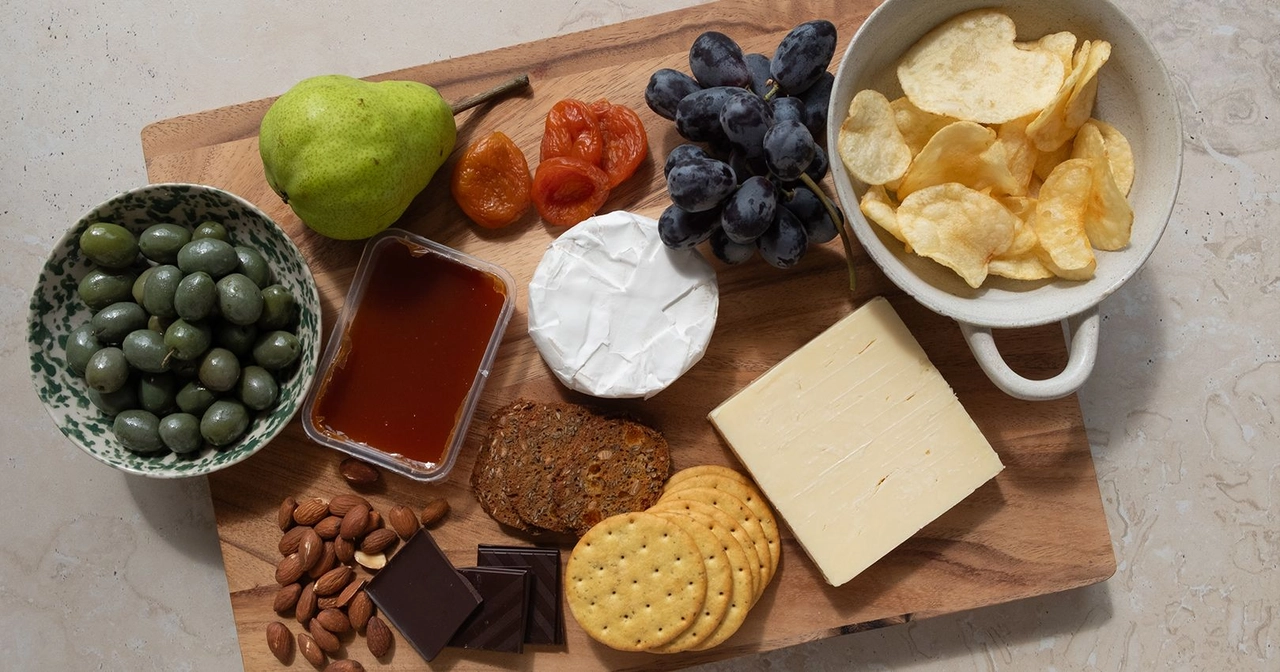 Ingredients to make a charcuterie board lunch plate.