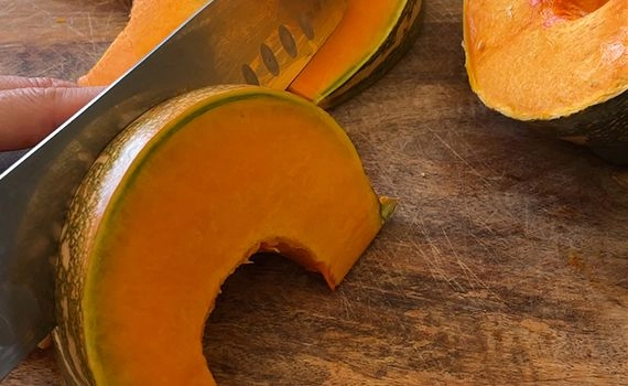 Cutting a pumpkin into 'moon' wedges