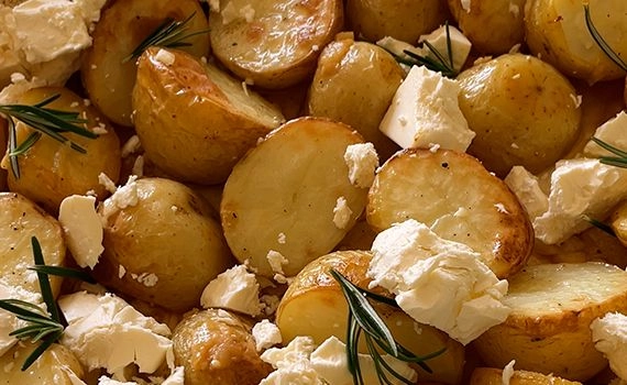 Feta and rosemary added to partially baked potatoes