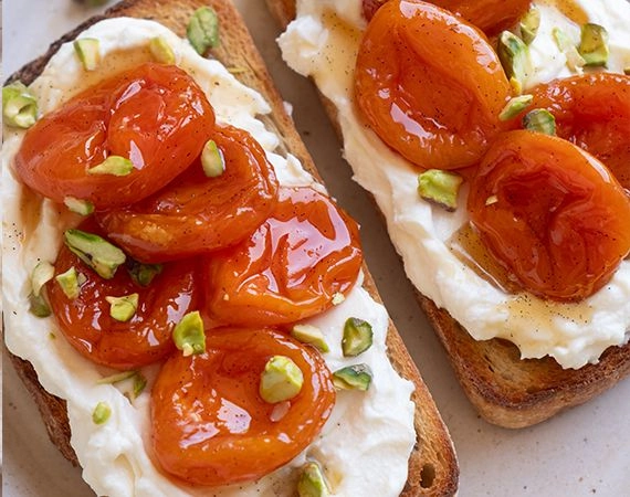 Whipped ricotta, roached apricots and pistachios on toast.