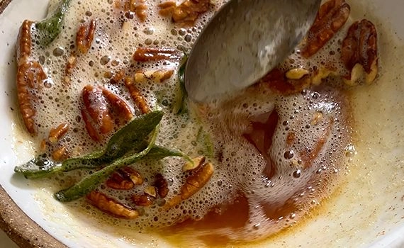 Brown butter with pecans and crispy sage in a bowl