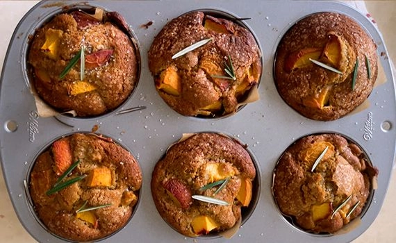 Baked peach, rosemary and olive oil muffins